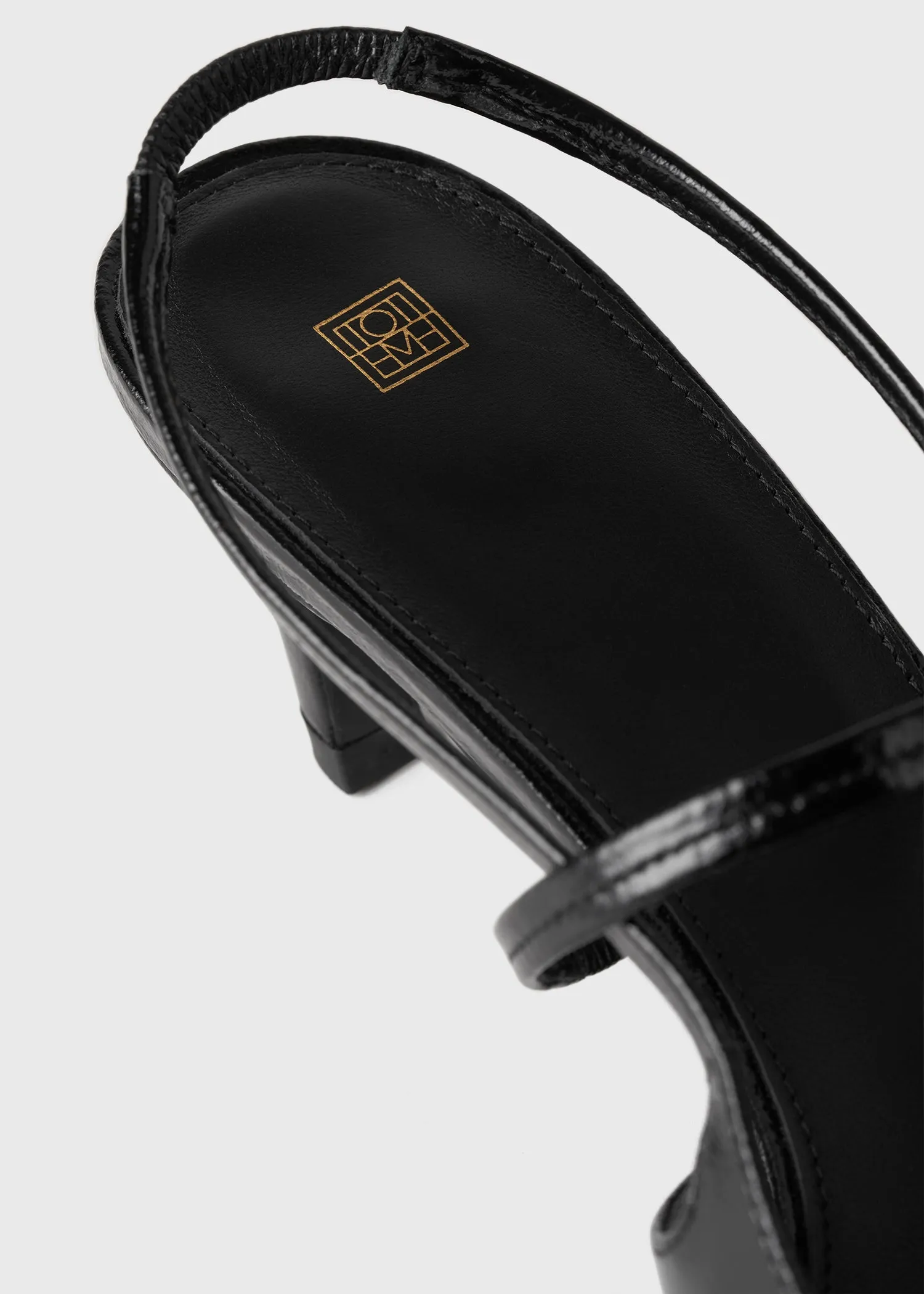 Sharp crackled-leather slingbacks black